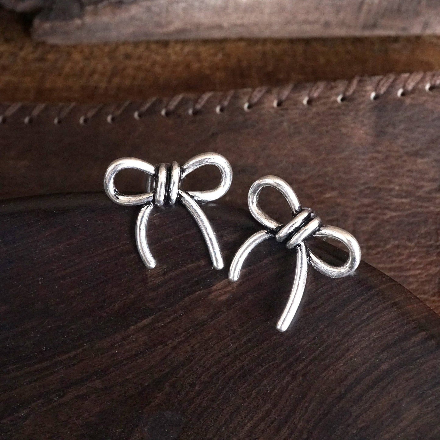 Silver Bow Statement Earrings