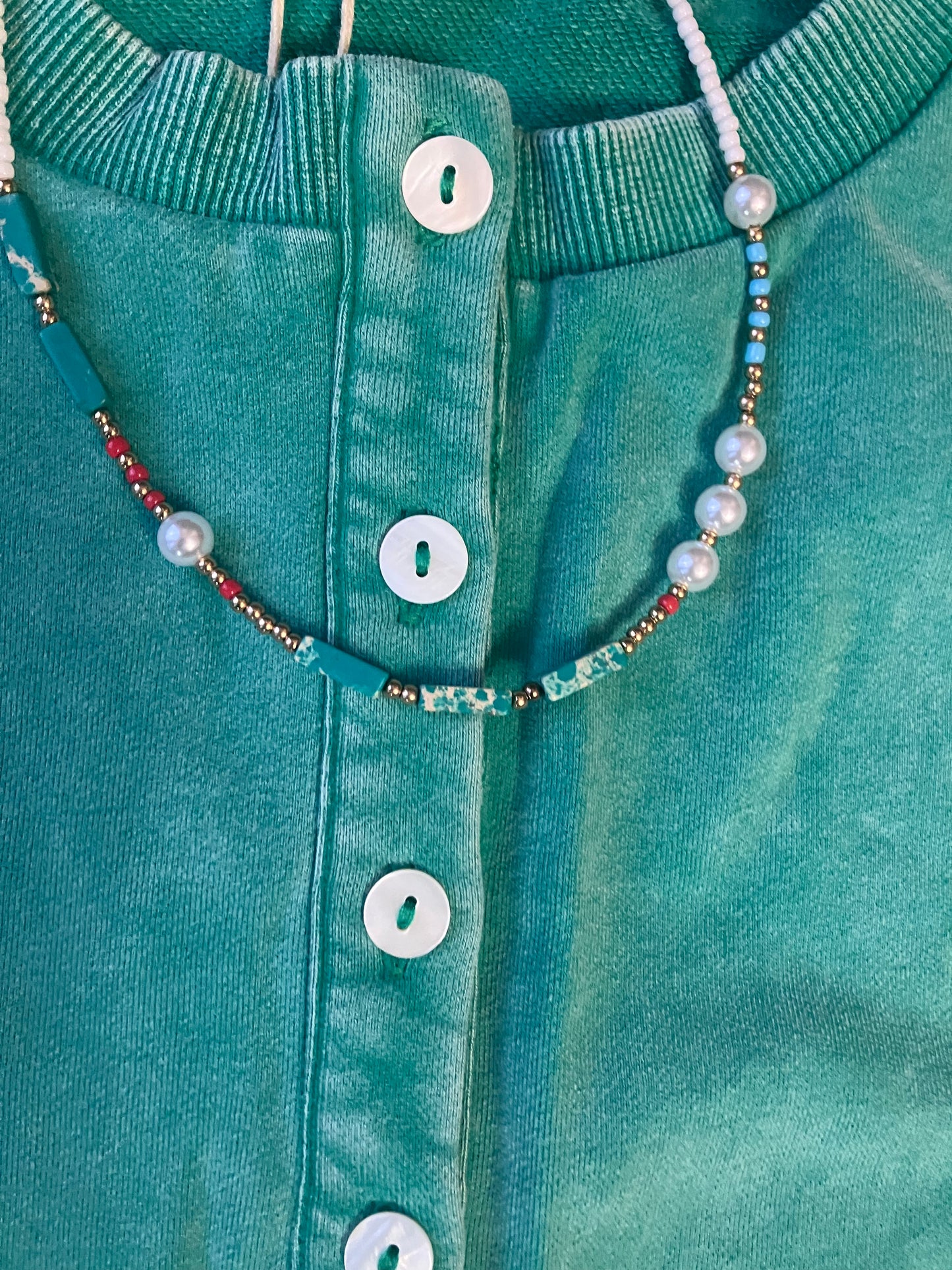 Green washed button-up top with flutter sleeves from Farm Wife Threads - relaxed fit, raw cut sleeve edge.