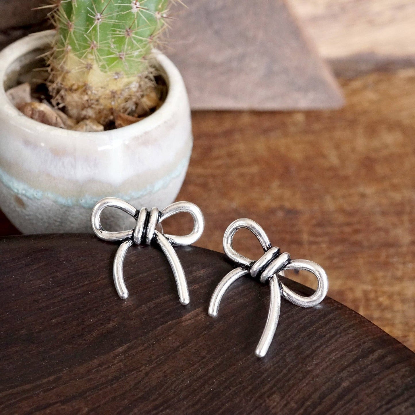 Silver Bow Statement Earrings