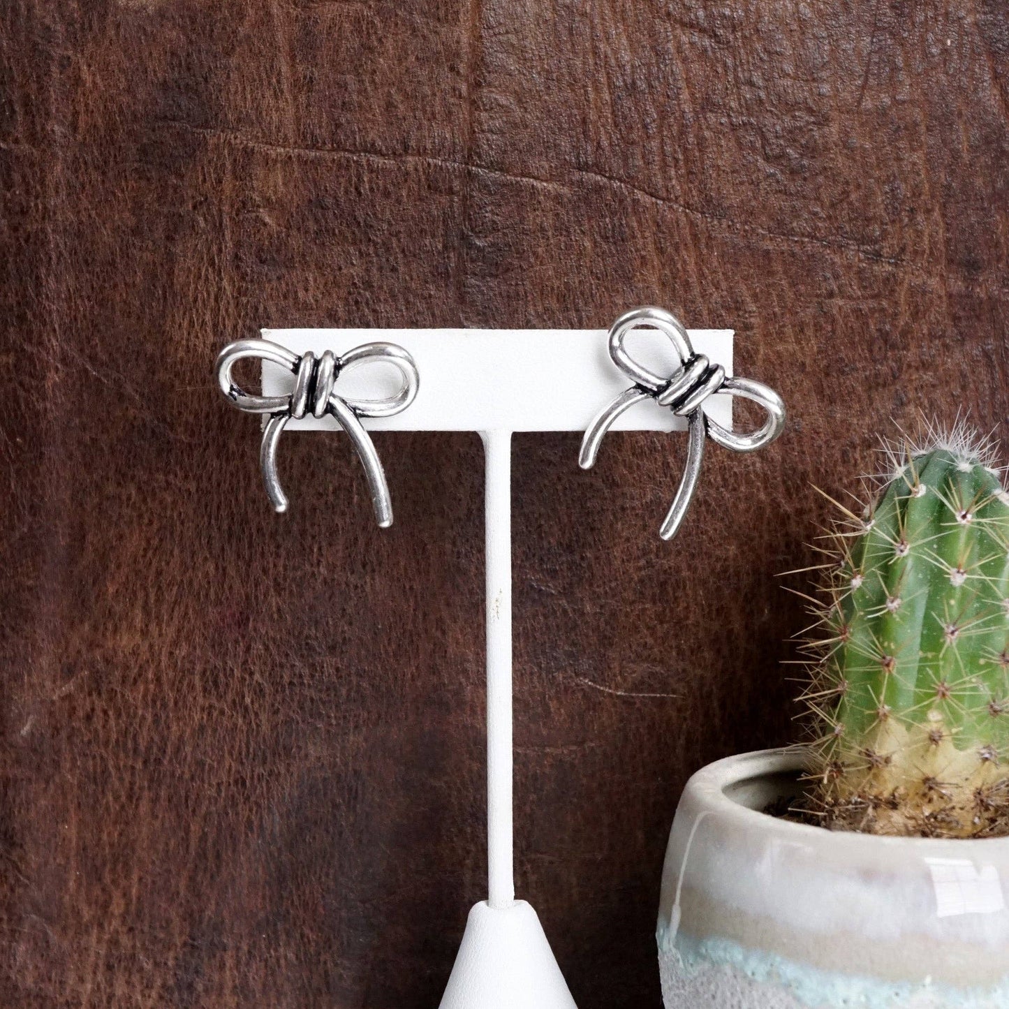 Silver Bow Statement Earrings
