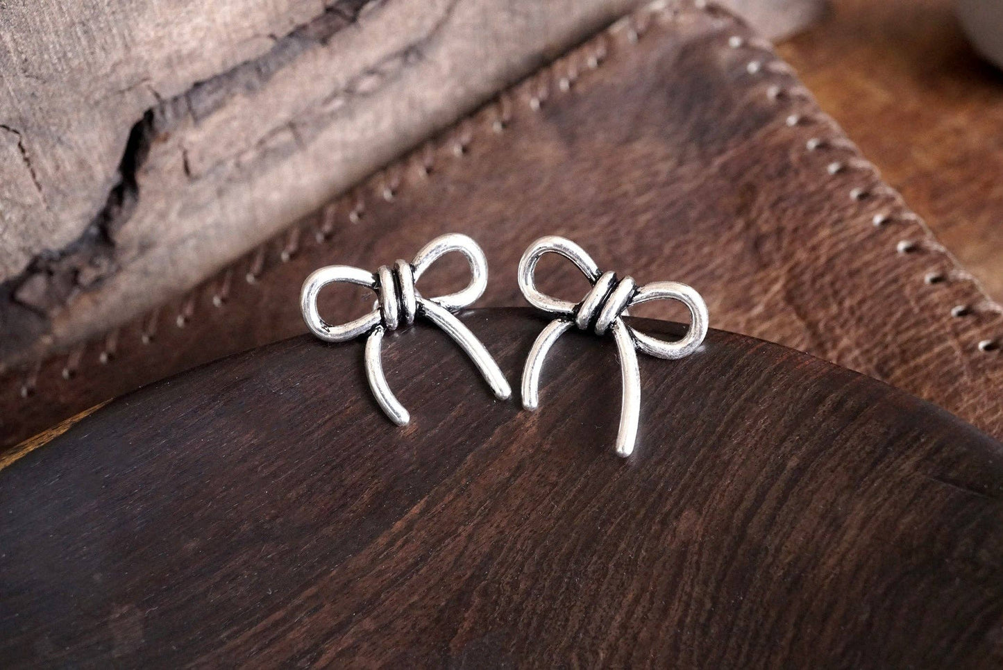 Silver Bow Statement Earrings