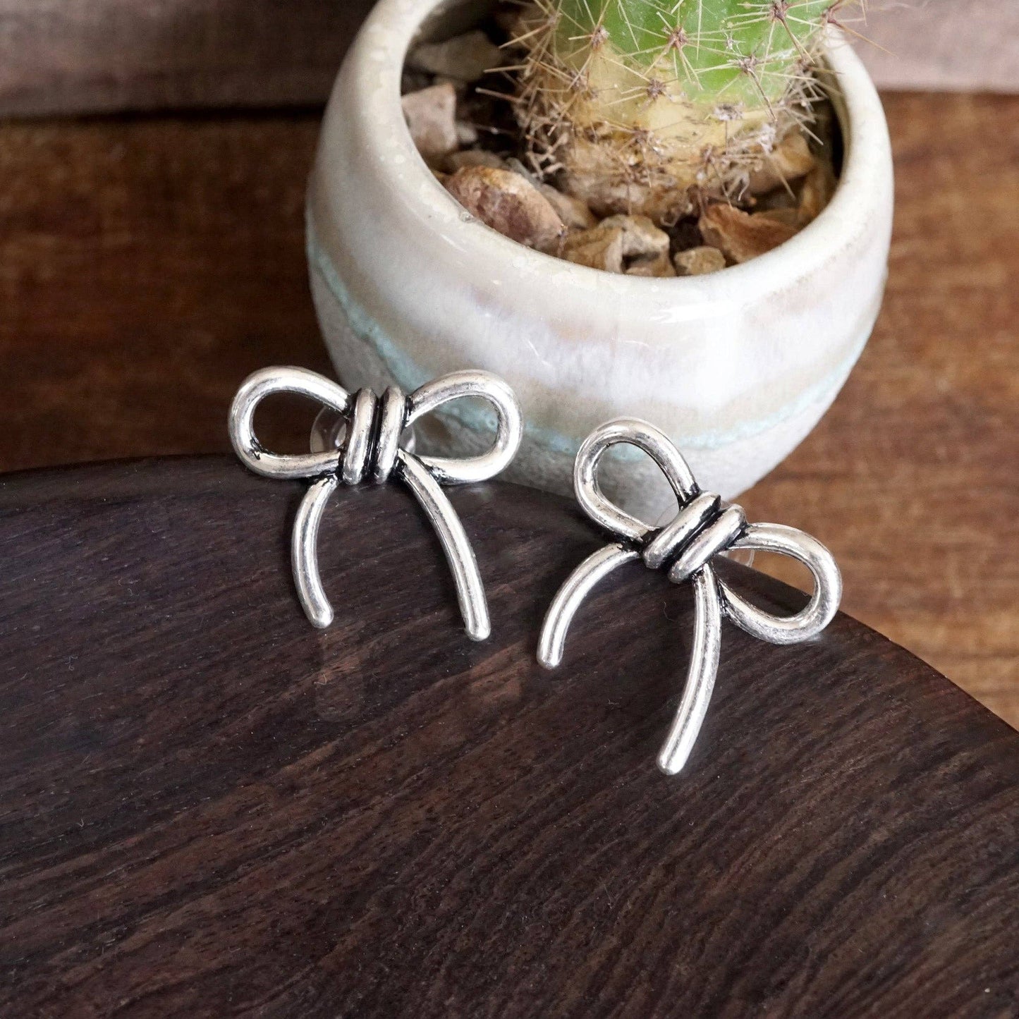 Silver Bow Statement Earrings