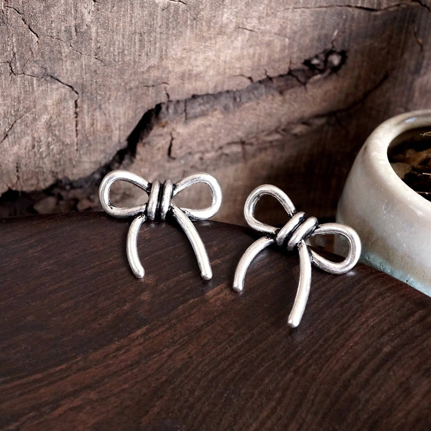 Silver Bow Statement Earrings