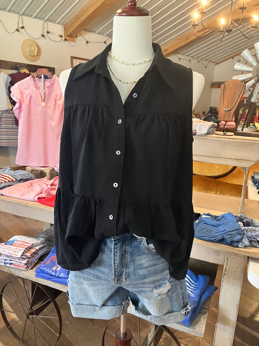 Chic black sleeveless peasant top with buttons and tiered ruffle hem for women by Farm Wife Threads.