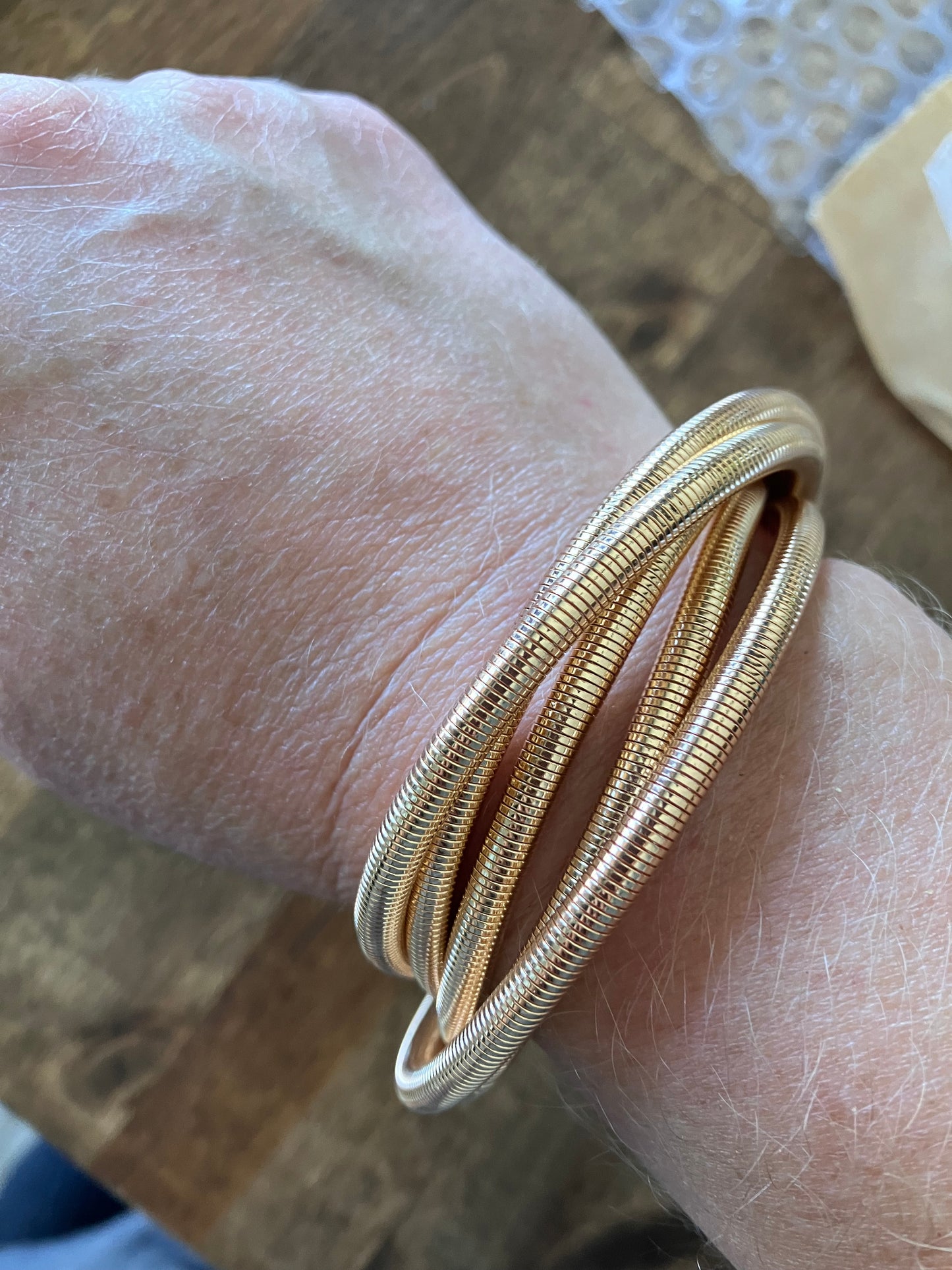 Gold tone multi strand flexy stretchy bracelet bangle