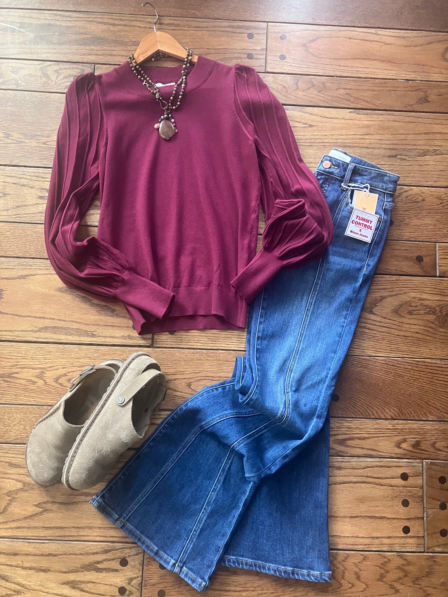 Farm Wife Threads: SOPHIA WINE Puff Sleeve Top, Flare Jeans, & Birkenstock Clogs Outfit. Stylish Women's Clothing on Wood Floor